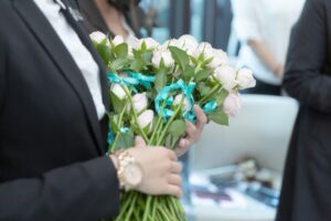 A woman holds flowers