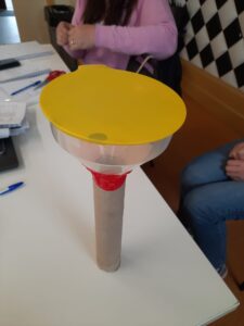 A stethoscope made of a funnel, a balloon and a cardboard tube