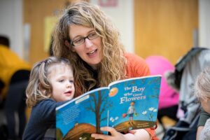 Mum reading with her child at launch of a Dolly Parton's Imagination Library in Tallaght.